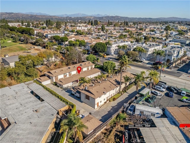 birds eye view of property with a mountain view