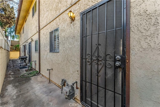 property entrance with a patio area