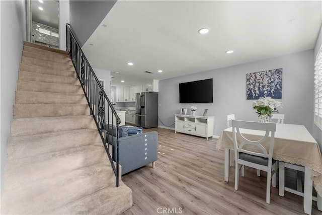 living room with light hardwood / wood-style flooring