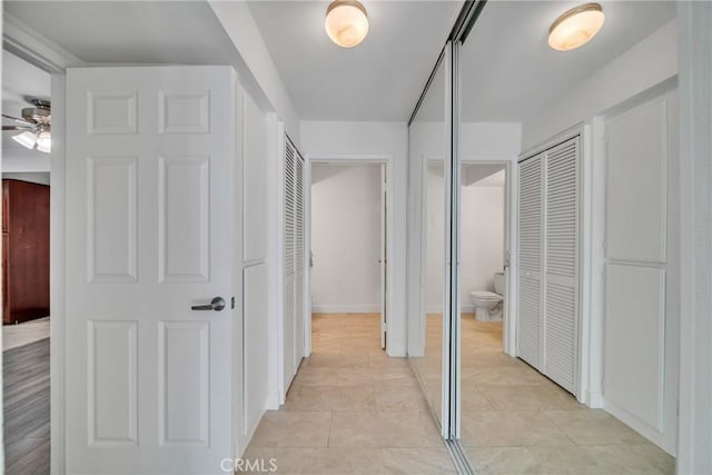 corridor with light tile patterned floors