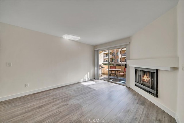 unfurnished living room with hardwood / wood-style floors