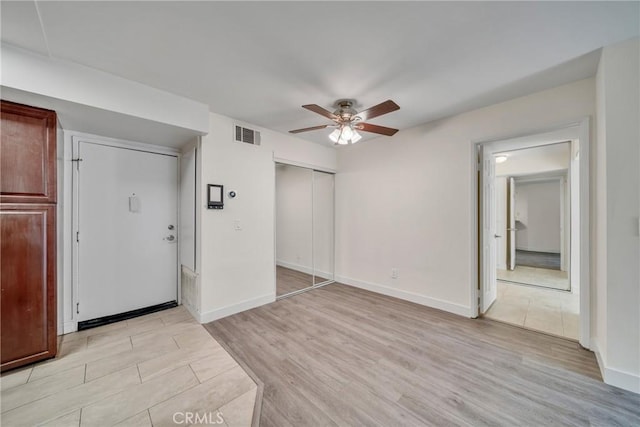 entryway featuring ceiling fan and light hardwood / wood-style floors