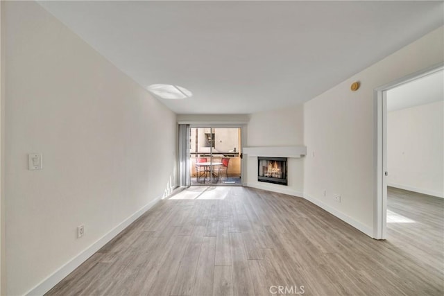 unfurnished living room with light wood-type flooring