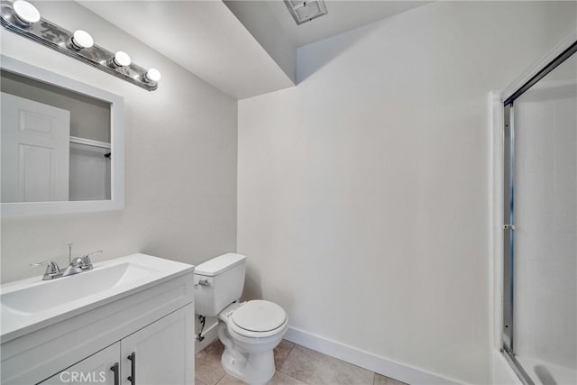 bathroom with walk in shower, tile patterned flooring, vanity, and toilet