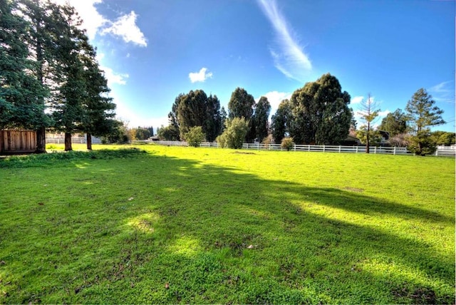 view of yard with a rural view