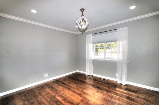 unfurnished room featuring dark wood-type flooring, crown molding, and an inviting chandelier