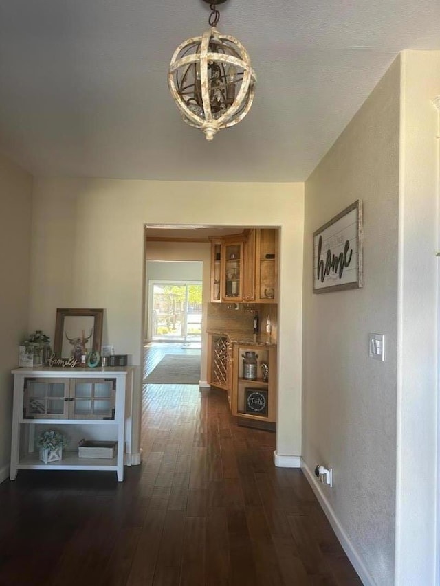 hall with dark wood-type flooring