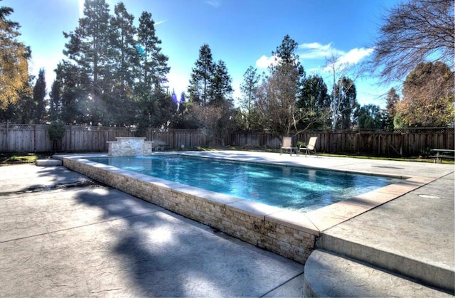 view of swimming pool featuring a patio