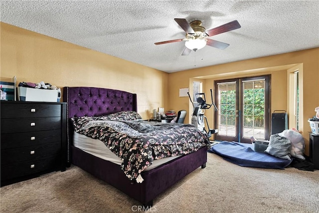 bedroom featuring ceiling fan, carpet floors, and a textured ceiling