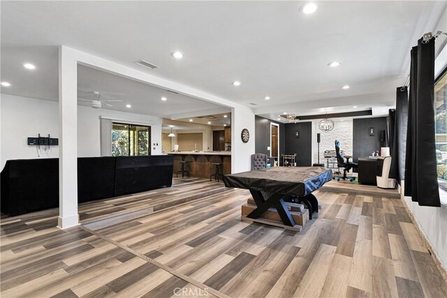 recreation room with pool table and light wood-type flooring