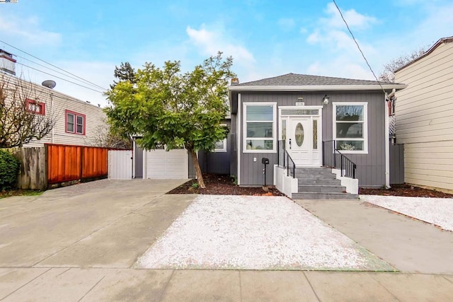 bungalow-style home with an outbuilding and a garage