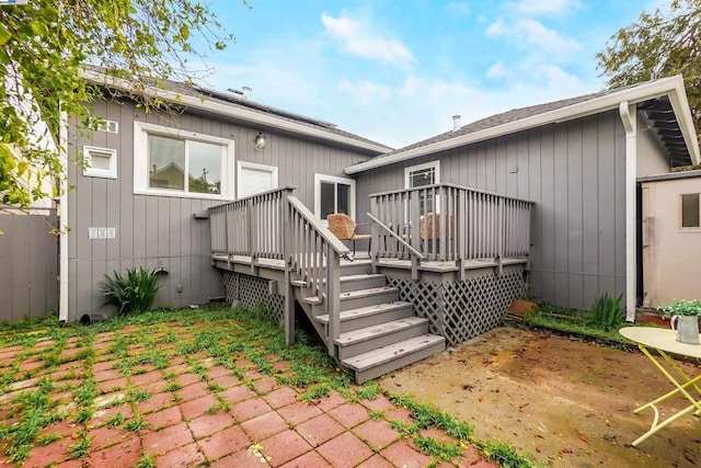 back of property with a wooden deck