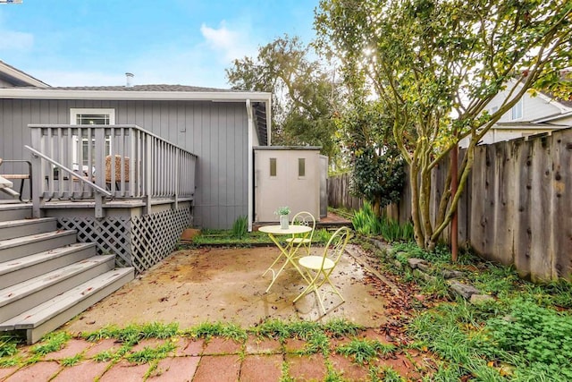 view of yard with a patio area and a wooden deck