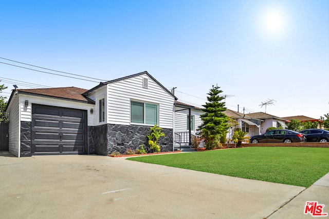 single story home with a front yard and a garage