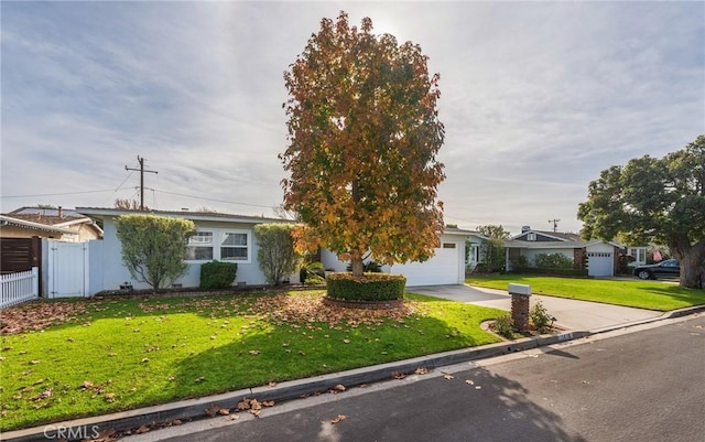 single story home with a front lawn and a garage