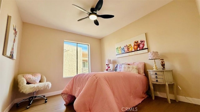 bedroom with ceiling fan and hardwood / wood-style floors