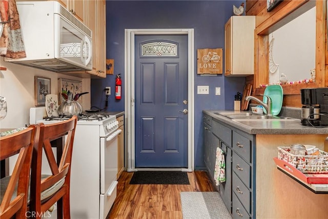 kitchen with light wood-type flooring, sink, white appliances, and gray cabinets