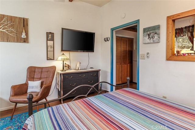 bedroom with hardwood / wood-style floors