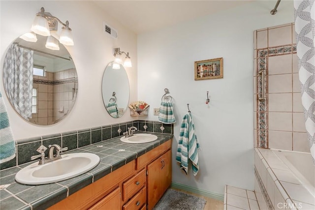 bathroom with shower / tub combo and vanity