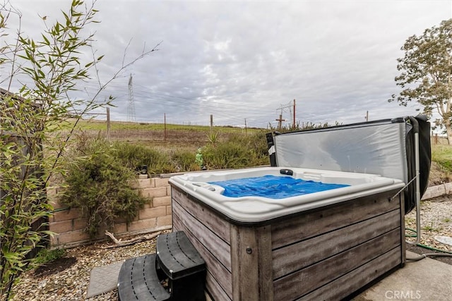 exterior space featuring a hot tub