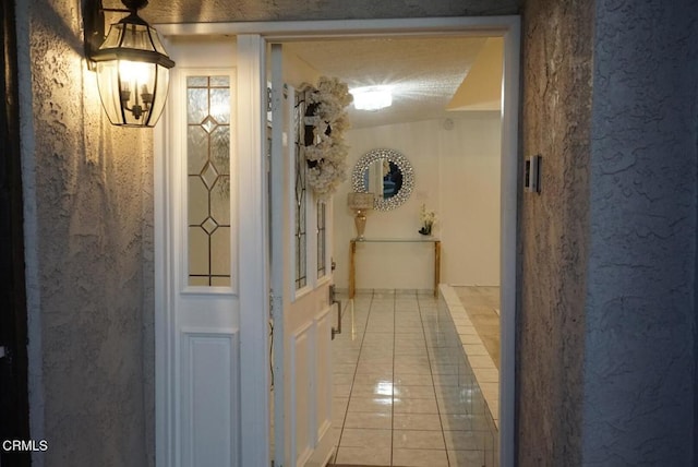 hall with light tile patterned flooring