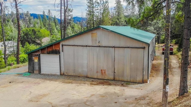 view of outbuilding featuring a mountain view