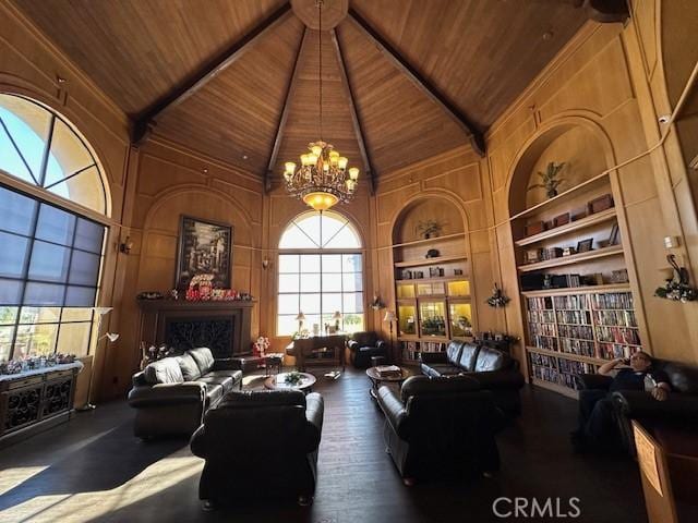 living room with built in shelves, dark hardwood / wood-style flooring, high vaulted ceiling, and wood ceiling