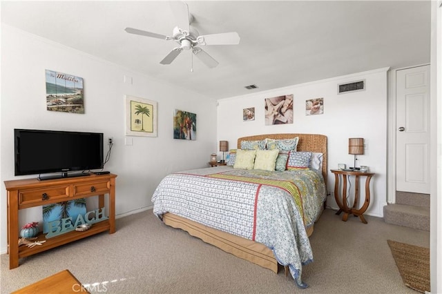 bedroom with ceiling fan, crown molding, and light colored carpet