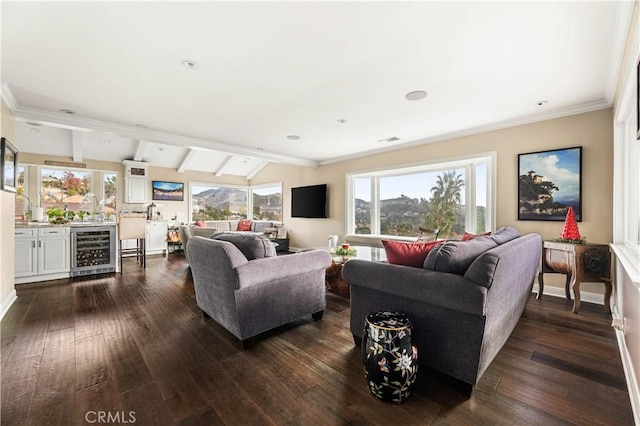 living room with dark hardwood / wood-style flooring, indoor bar, vaulted ceiling with beams, wine cooler, and ornamental molding