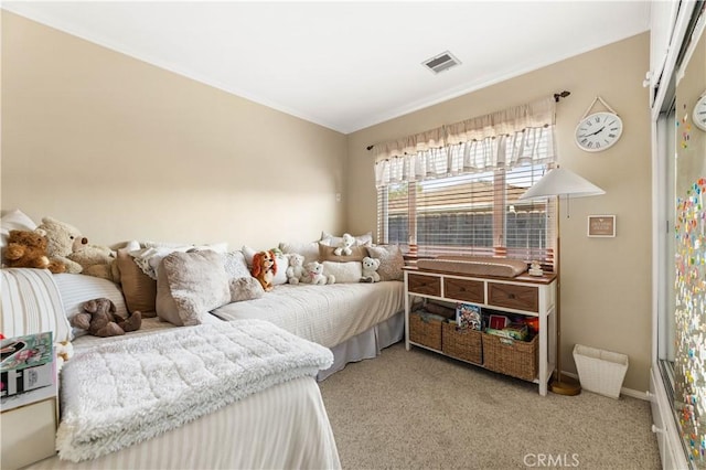 bedroom featuring light colored carpet