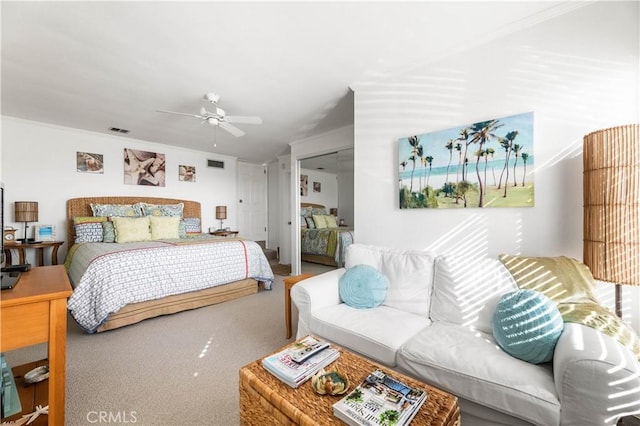 bedroom featuring ceiling fan, a closet, and carpet floors