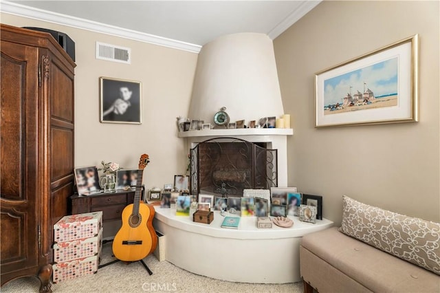 living room with a fireplace and crown molding