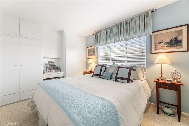 carpeted bedroom with a closet