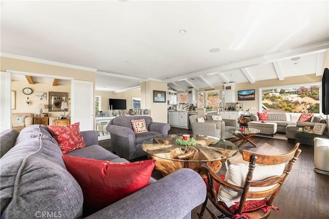 living room featuring lofted ceiling with beams, ornamental molding, and hardwood / wood-style flooring