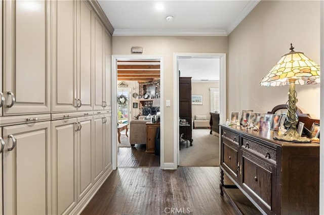 hallway featuring dark hardwood / wood-style flooring and crown molding