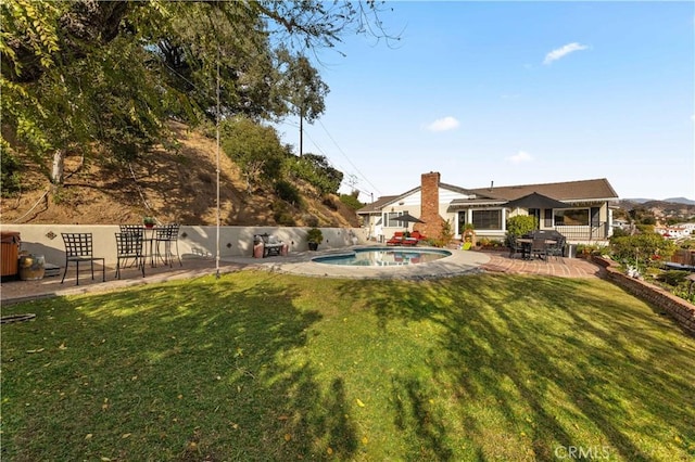 view of yard with a patio and a fenced in pool