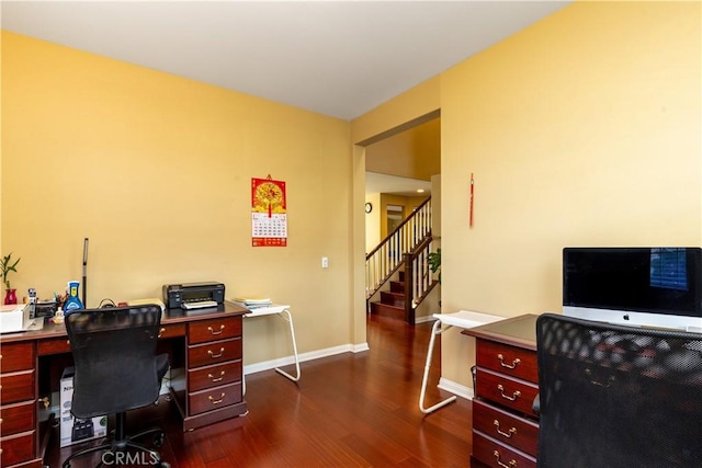 office area featuring dark wood-type flooring and baseboards