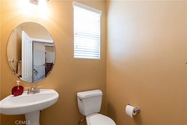 bathroom with a sink and toilet