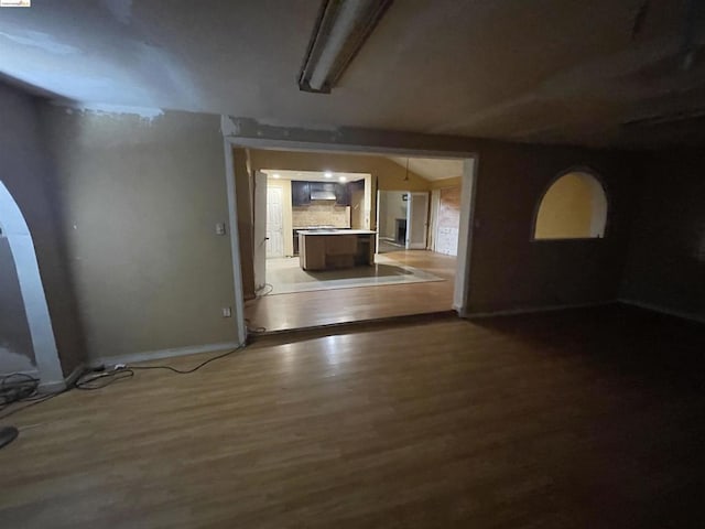 unfurnished room with hardwood / wood-style flooring