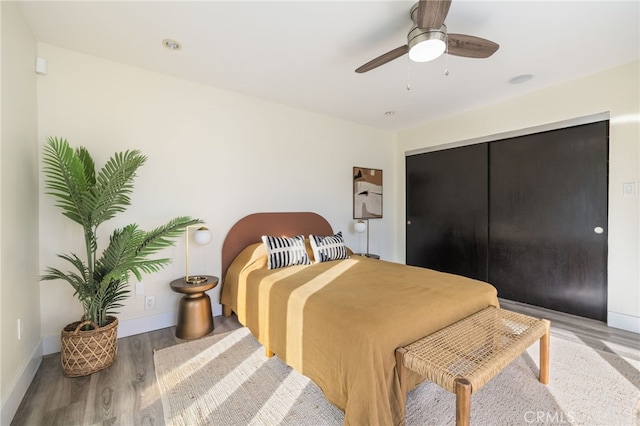 bedroom featuring ceiling fan and hardwood / wood-style flooring