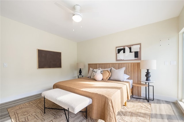 bedroom with ceiling fan and light wood-type flooring