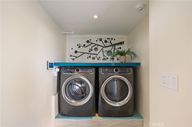 laundry room with independent washer and dryer