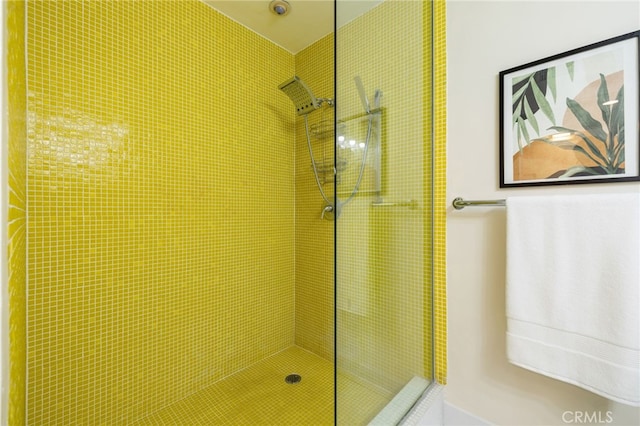 bathroom with a tile shower