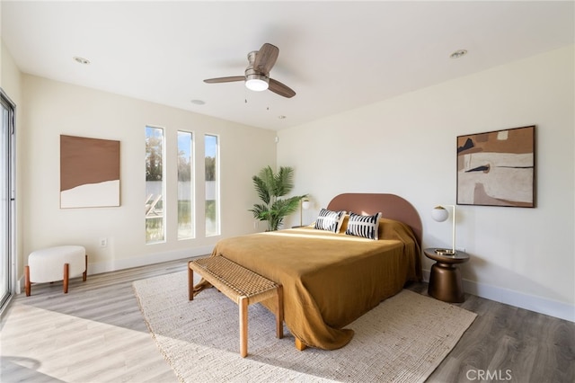 bedroom featuring ceiling fan and wood-type flooring