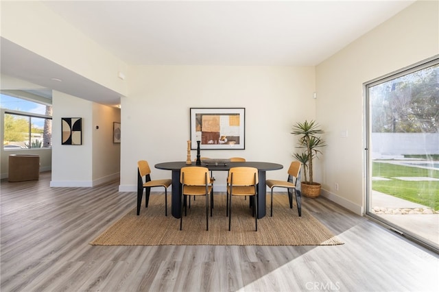 dining area featuring light wood-type flooring