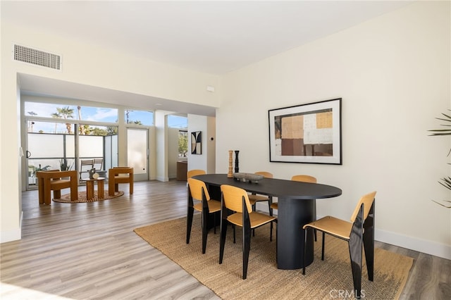 dining area with light hardwood / wood-style floors