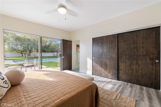 bedroom with ceiling fan, light hardwood / wood-style floors, and access to outside