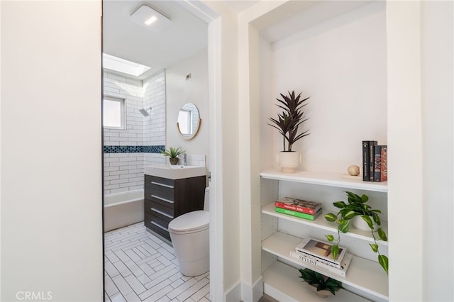 bathroom with toilet and vanity