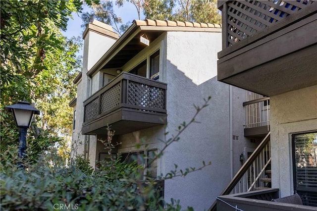 view of home's exterior featuring a balcony