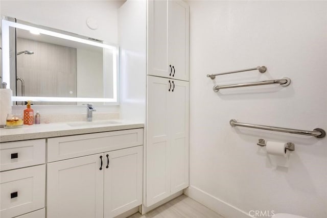 bathroom with vanity and walk in shower